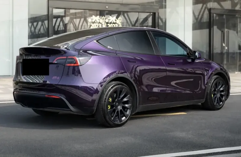 Tesla Model 3 with custom purple high-gloss vinyl wrap in Bellevue WA