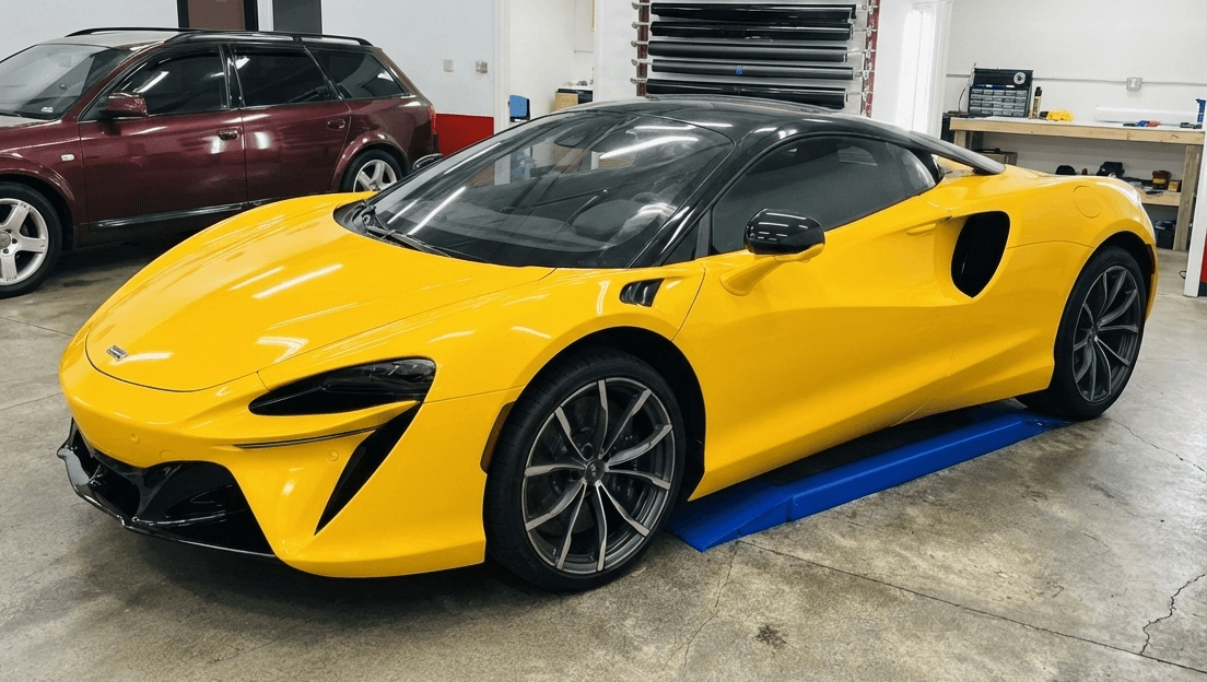 Bespoke Carbon Window Tint on a yellow McLaren Artura in our shop